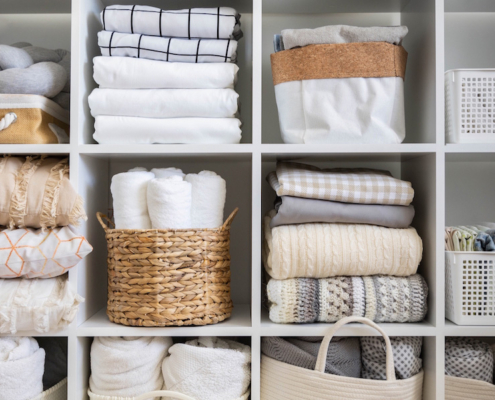 Linens and things in organized baskets and cubbies