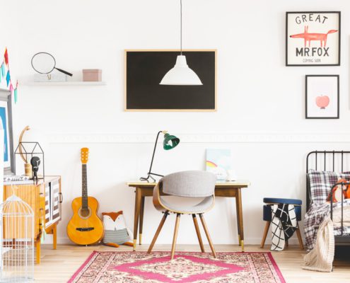 Aging Up Your Child's Room includes the desk fit for a teen guitar and wall artwork for youth