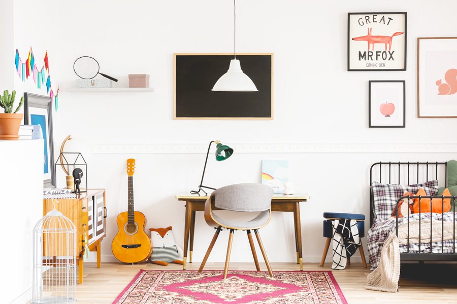 Aging Up Your Child's Room includes the desk fit for a teen guitar and wall artwork for youth