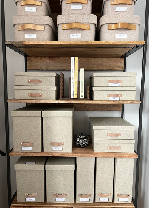 Bookshelf with labeled storage containers