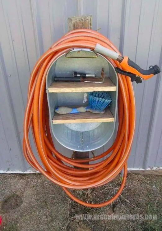 bucket re-purposed as a hose coil storage area