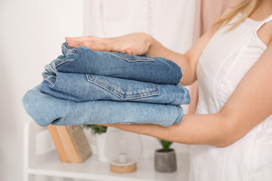 woman taking jeans out
