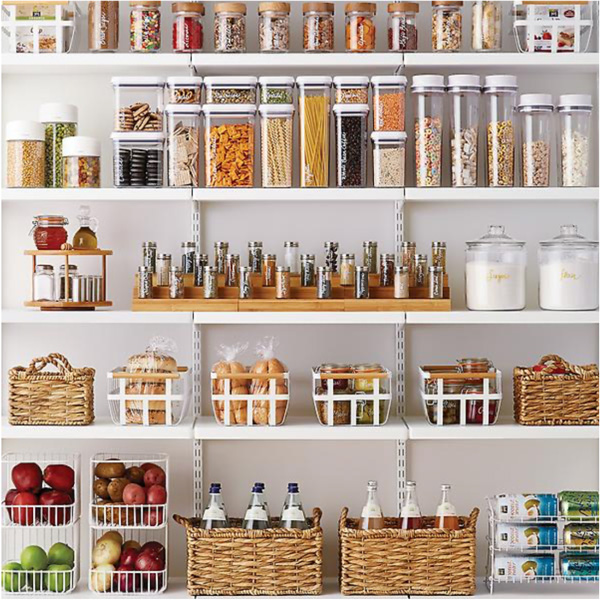 Cary Prince Organizing features an organized pantry with baskets bins canisters and turntables for optimal storage