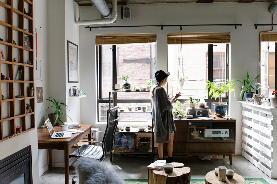 Cary Prince Organizing showing a woman in her living room taking a home inventory