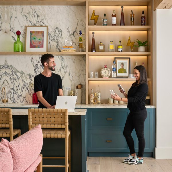 Cary Prince Organizing showing a woman taking a photo of a home item for her home inventory